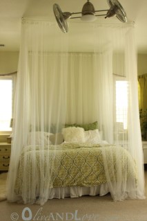  Ceiling mounted bed canopy consisting of eyebolts, turn buckles and wire thread through sheer curtains